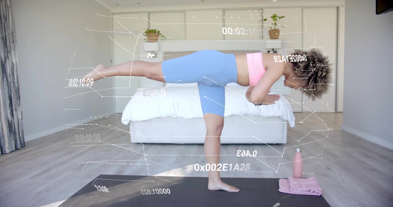 Woman shifting into airplane pose on yoga mat, holding balance while HUD metrics tracking fitness