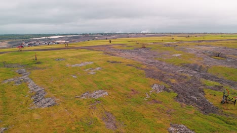 Forward shot of Louisiana landfill with gas wells