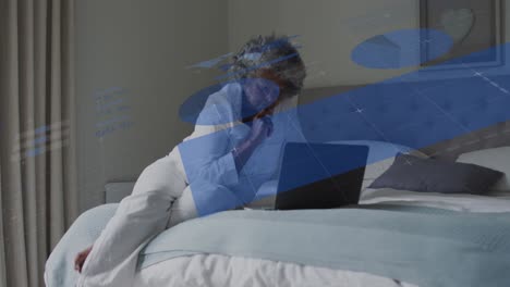 animation of data processing over senior african american woman using laptop