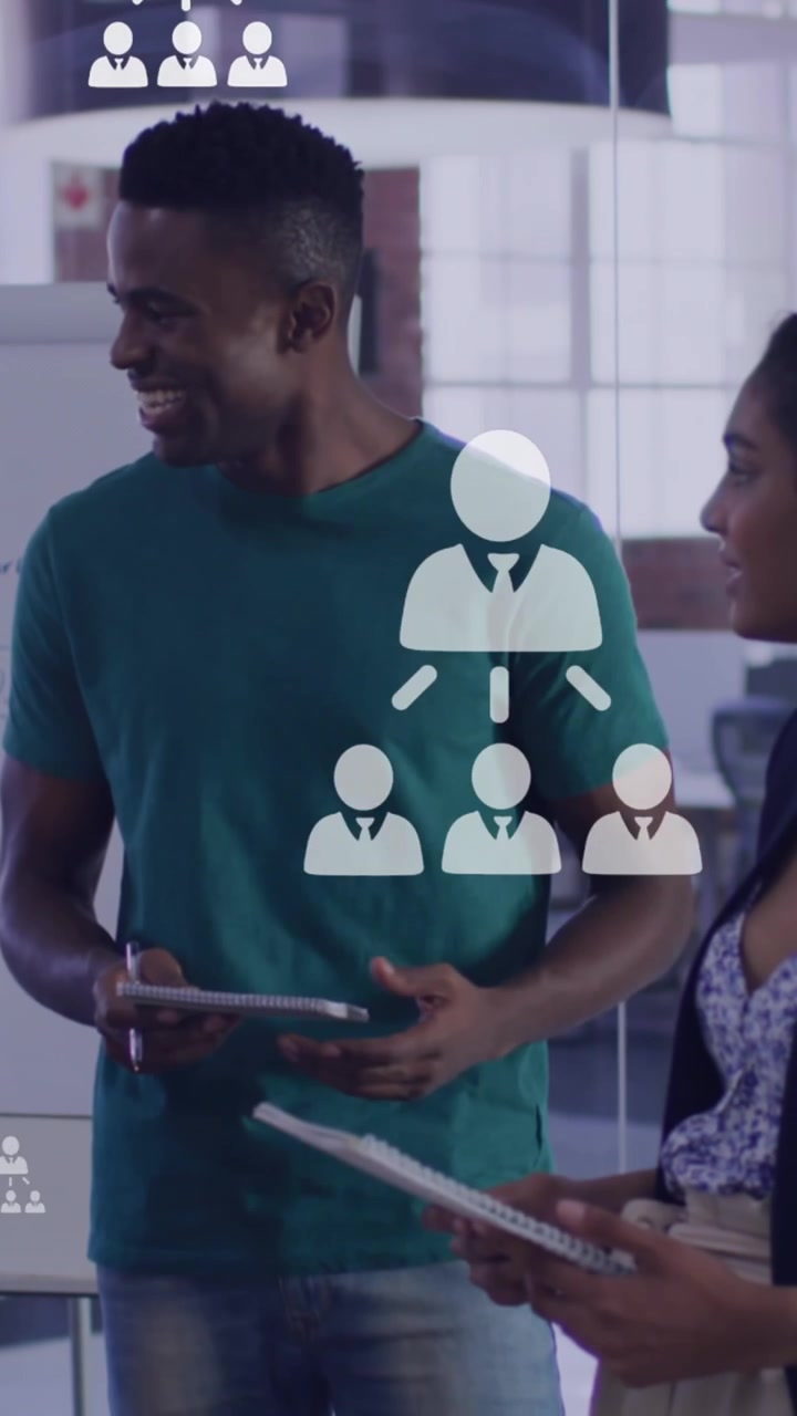 Animation of networking icons and data processing over diverse business people
