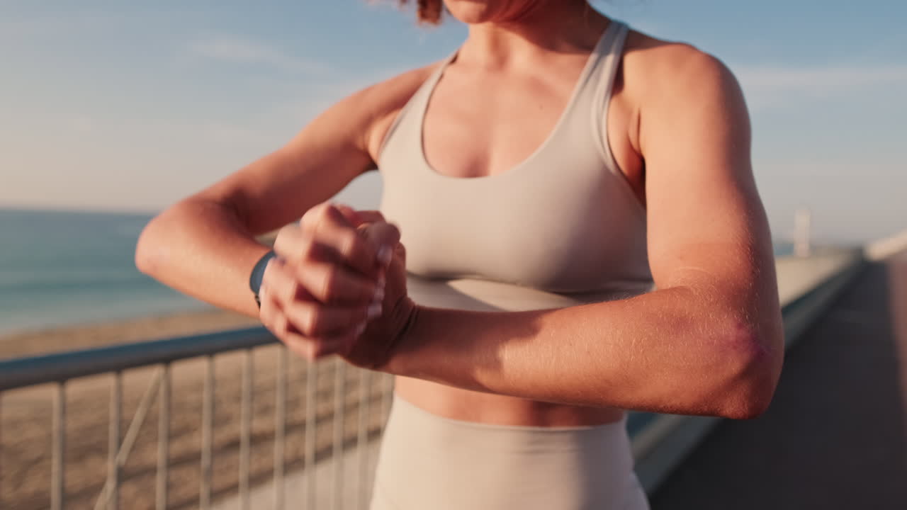 Woman Starts Workout on Beach Boardwalk