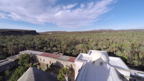 Aerial-shot-of-the-Jesuit-Mission-San-Ignacio-at-the-morning,-Mulegé-Municipality,Baja-California-Sur