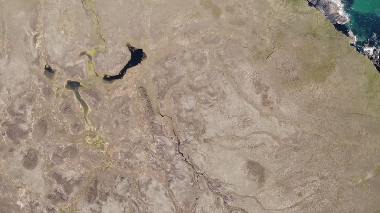 Drone shot of a moorland featuring various small lochs and peat bogs