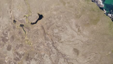 Drone-shot-of-a-moorland-featuring-various-small-lochs-and-peat-bogs