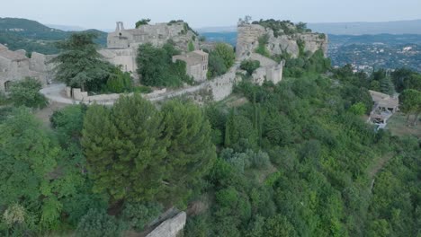 aerial drone luberon provence saignon france medieval town church at sunrise