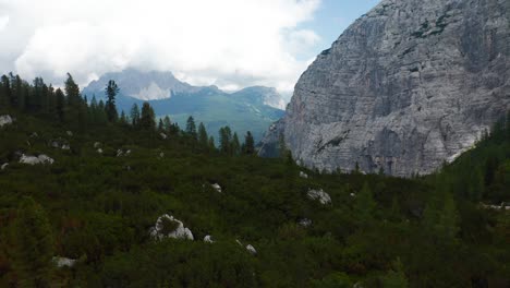 aerial flying over forest woodland near lake sorapis in the dolomites