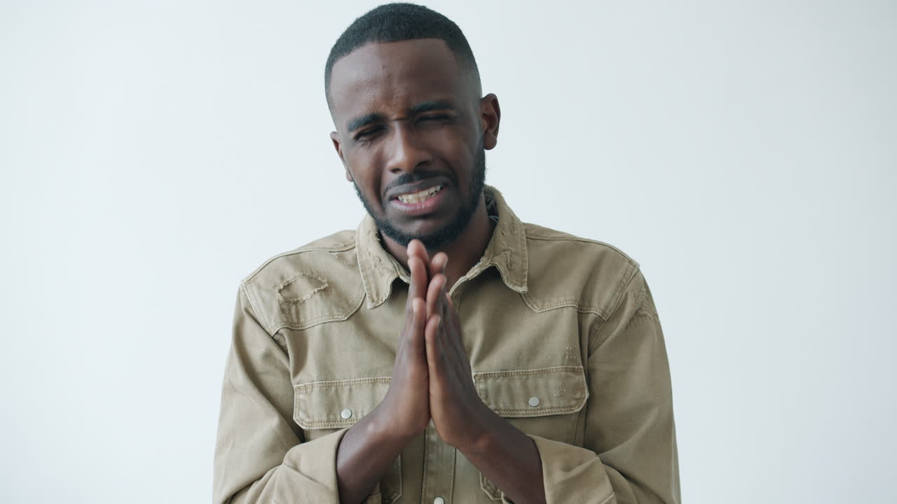 Man begging, pleading, or praying