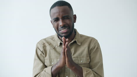 man begging, pleading, or praying