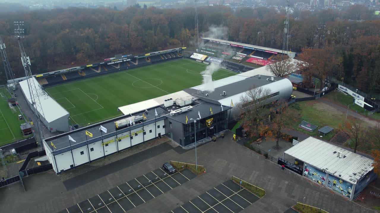 Aerial View of Football Stadium and Parking Lot on a Cloudy Day