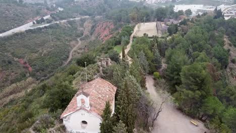 aerial flying over hermitage at castellbisbal. dolly forward