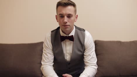 man put on wrist watch, groom dresses, male businessman waiting for meeting, hand with clock