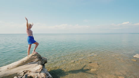 The-Young-Woman-Rejoices-On-A-Warm-Summer-Day-Raised-Her-Hands-Up-Stands-In-A-Beautiful-Place-On-The