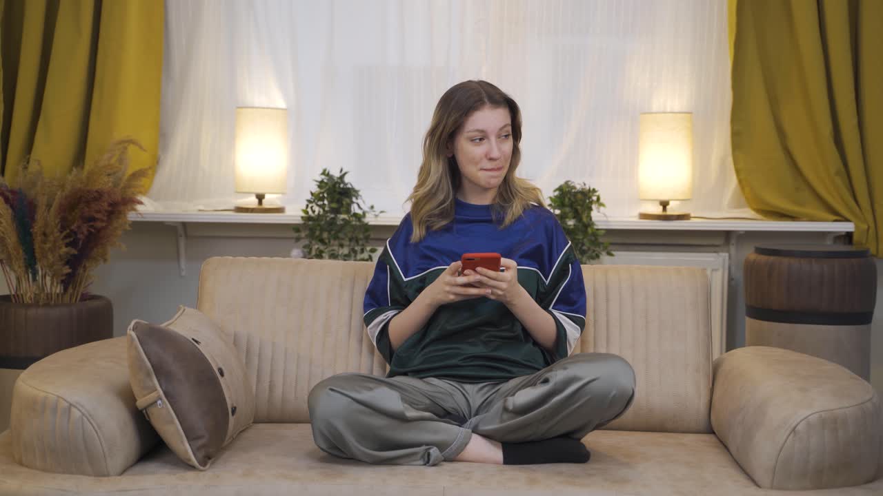 Happy and happy texting young woman.