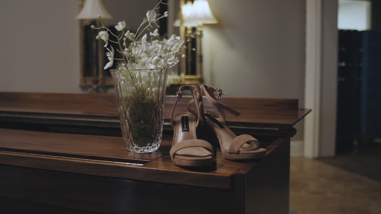 Dolly shot of bridal wedding shoes Bride Shoes and Bouqet On Wedding Day