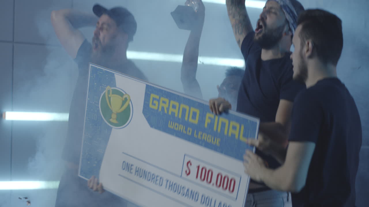 Gaming Tournament Team Celebrating their Victory Medium Shot of a Gaming Tournament Team Holding their Prize while Celebrating their Victory