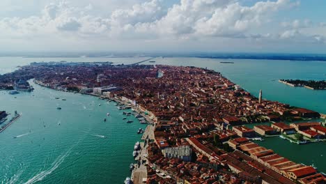 breathtaking drone flyover shows venice’s maze of waterways glowing, summer sun