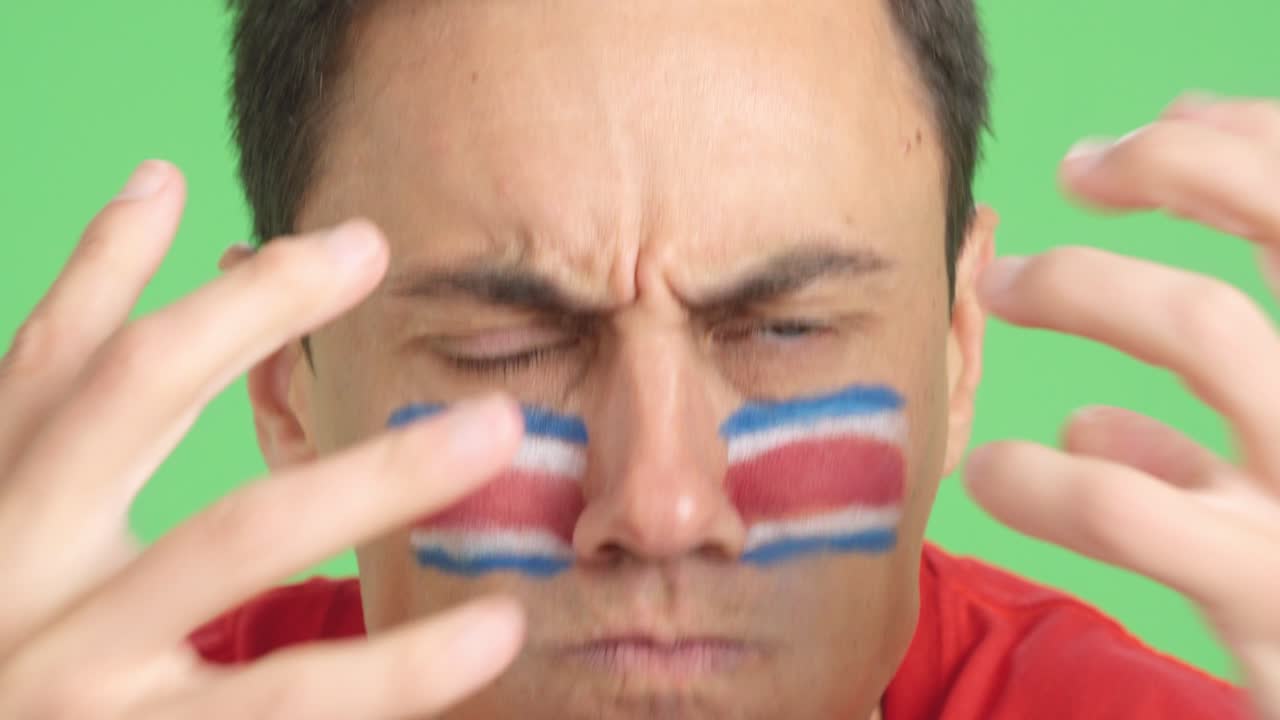 Man with costa rican national flag upset with a referee