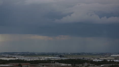 Time-lapse-dark-storm-clouds-passing-above-gloomy-Toronto-landscape