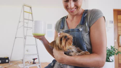 Portrait-of-a-Caucasian-woman-in-quarantine-during-coronavirus-pandemic,-drinking-a-tea