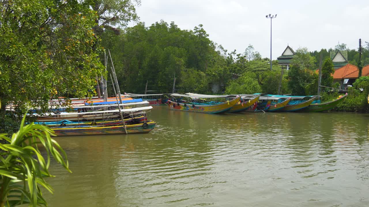 Colorful Tourist Boats Docked At The Port Of Phang Nang To James Bond Island In Phang Nga Bay, Thailand. Wide Shot