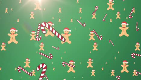 animación de caídas de bastones y galletas de navidad sobre fondo verde