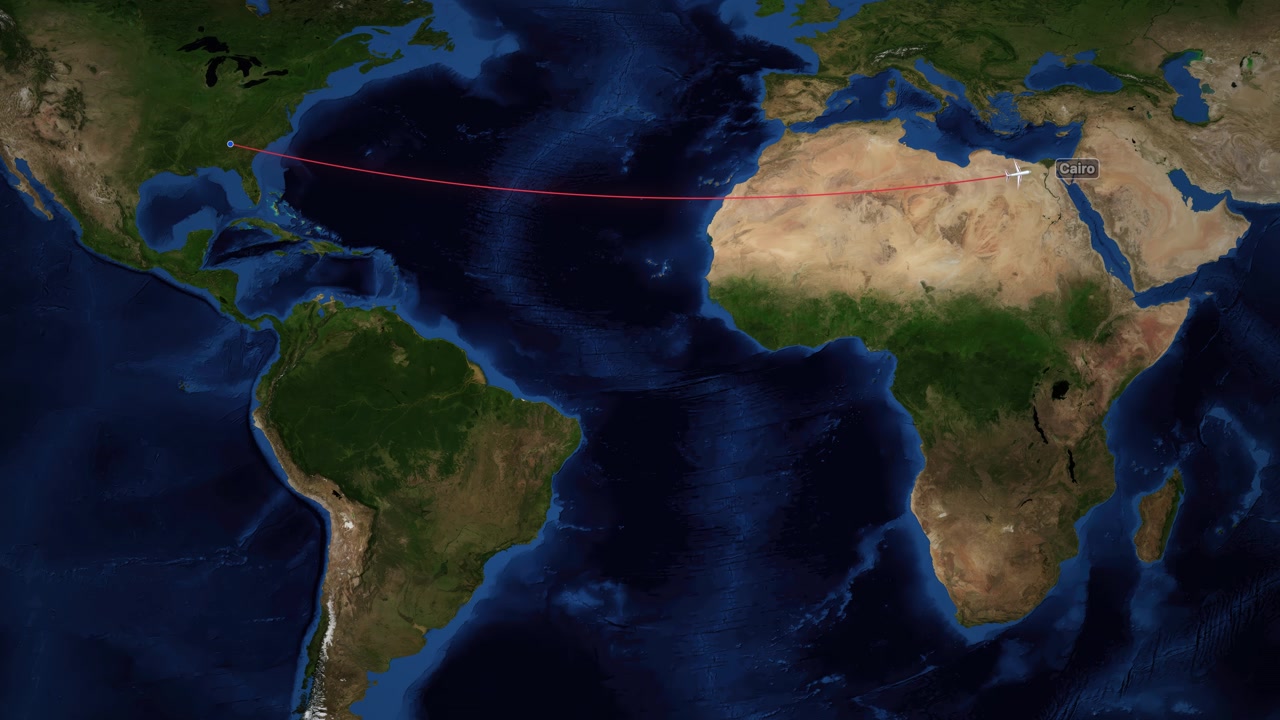 Satellite world map animation follows a plane flying from Atlanta to Cairo across the Atlantic
