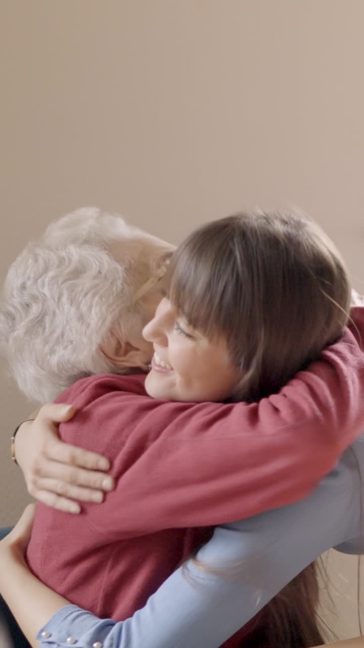 Granddaughter embracing her grandmother in a geriatric