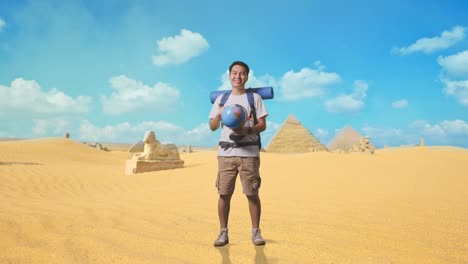 traveler in the desert with a globe