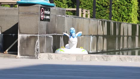 rubber ring floats and moves in a swimming pool