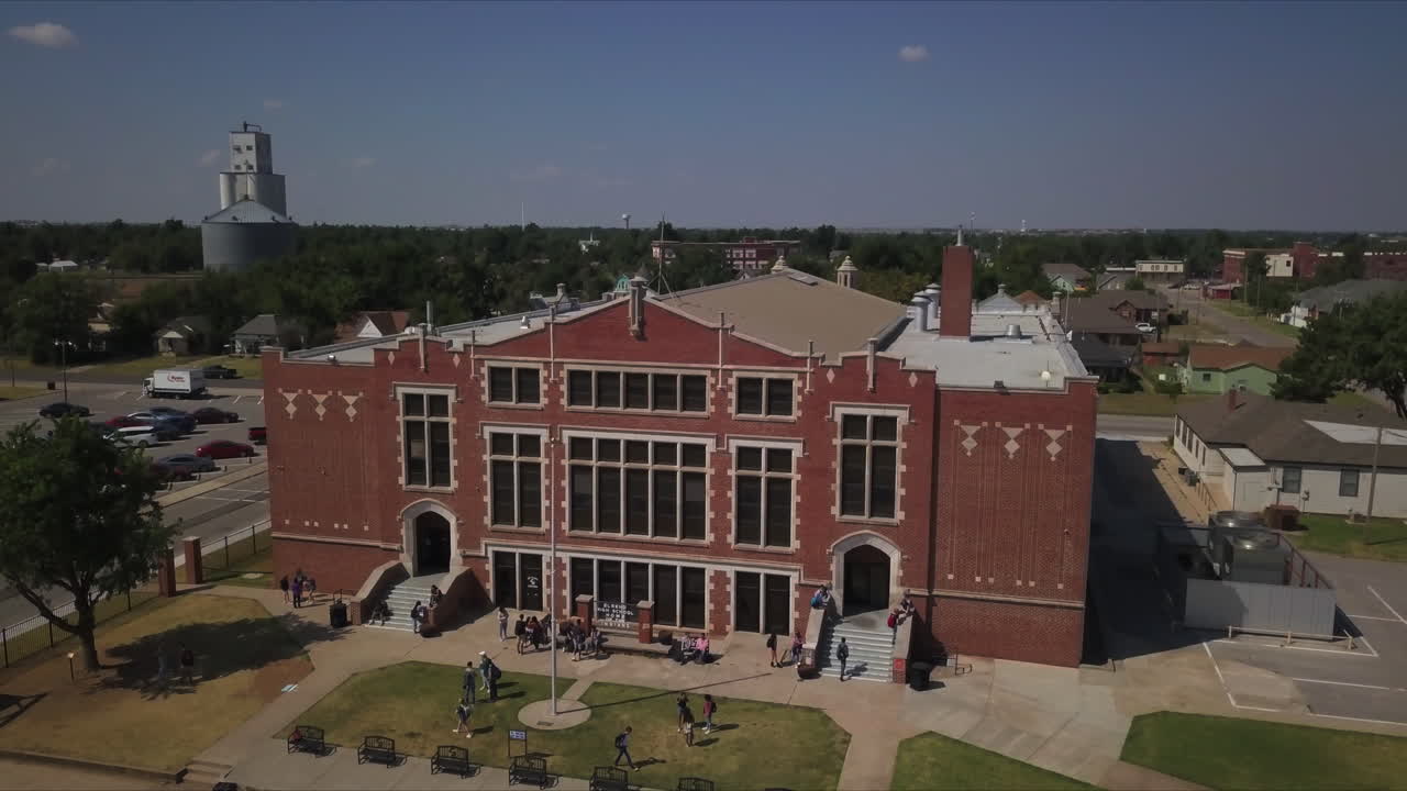 High angle view of famous university surrounded by various structure and greenery under clear sky in the summer
