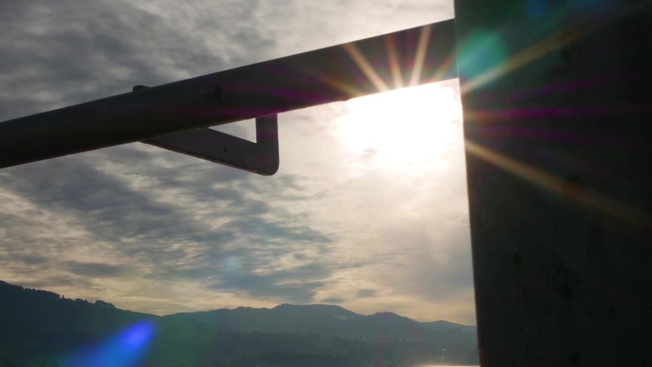 Timelapse shot from a cloudy sky. The sun shines through and give some nice flares.