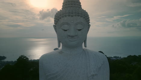 big buddha statue in phuket, thailand at sunset