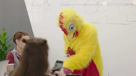 funny business meeting team leader chicken teaching financial market presentation on whiteboard happy students enjoying colorful bird boss in office lecture