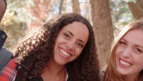 Happy-friends-outdoors,-close-up-handheld-left-to-right-pan