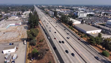 aerial view overlooking traffic on the 405 freeway, on a sunny day, in los angeles, california, usa - dolly, drone shot