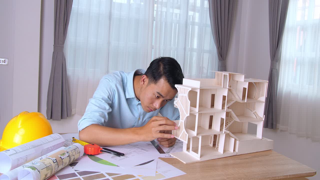 Male Architect Hands Making Model House