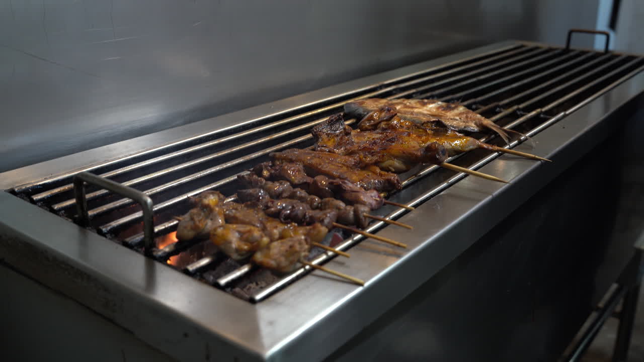 Chicken And Chicken Liver Skewers Griller On Stainless Griller. - close up, handheld