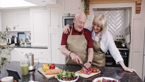 elderly couple cooking in the kitchen