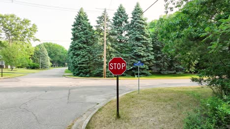 Pulling back from a stop sing to show the area around it