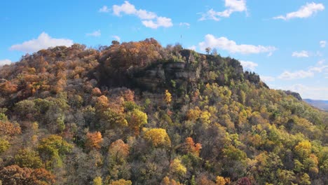 colorful fall bluff with an american flag on the pole at the top of the mountain-1