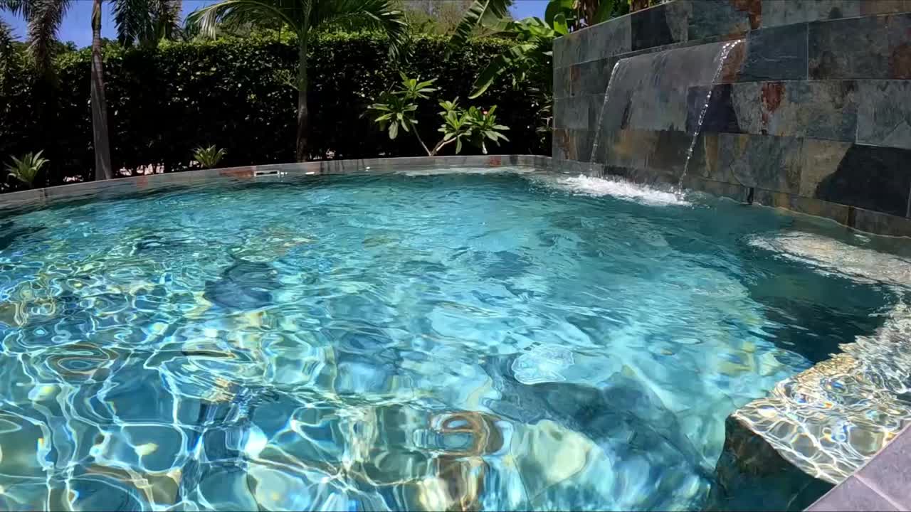 45" tv being thrown into pool, landing vertically