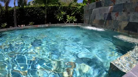 45"-tv-being-thrown-into-pool,-landing-vertically