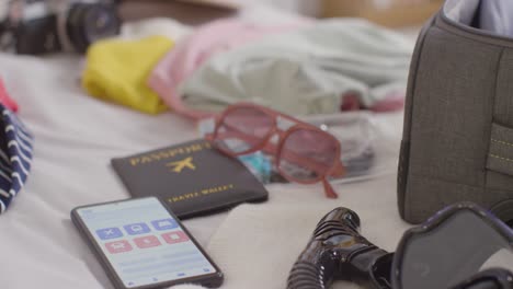 close up of open suitcase on bed at home being packed for summer holiday 6