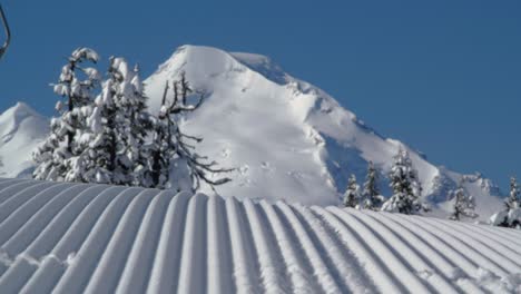 close snowboard groomed run carve with mt baker background