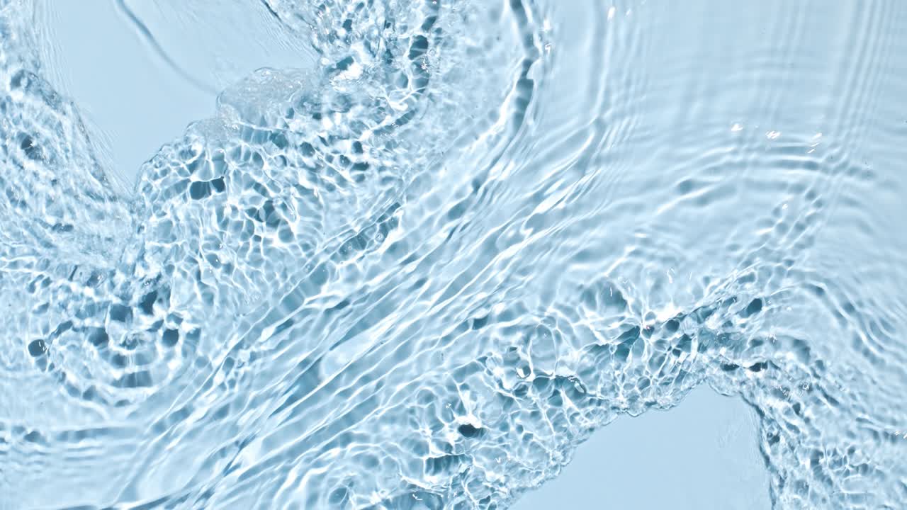 Water flows from opposite sides creating waves and ripples