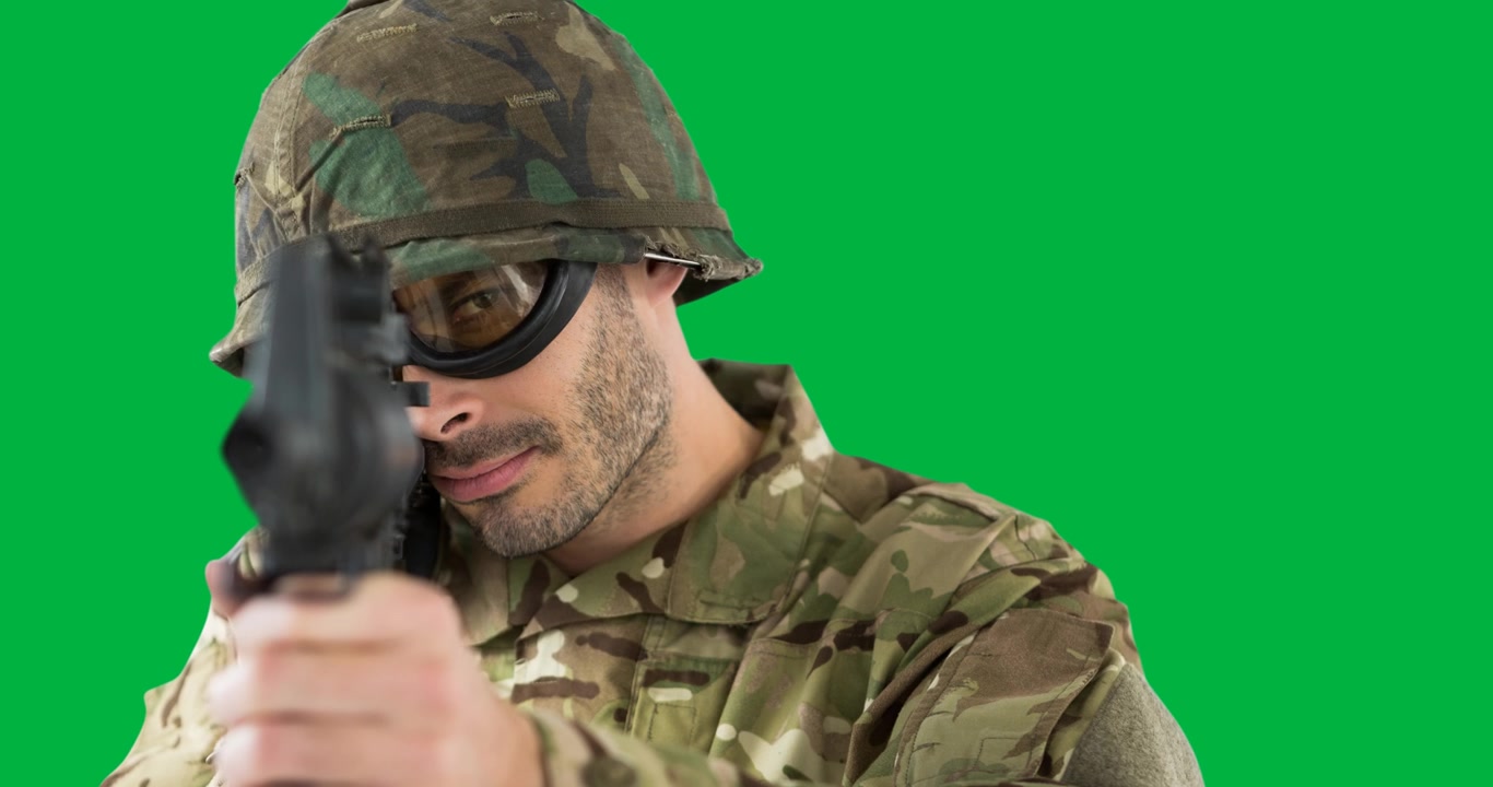 Caucasian male soldier in uniform holding a gun with copy space on transparent background