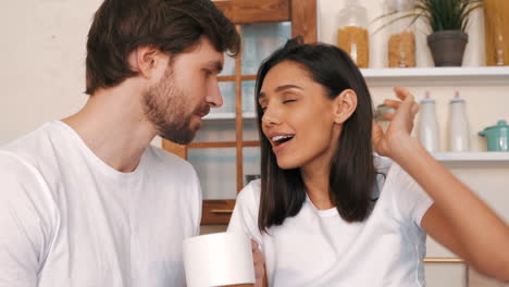 couple arguing in kitchen