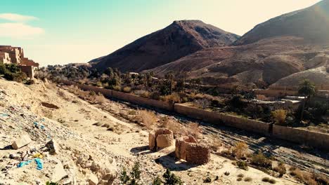 a-canyon-with-ruined-houses-in-a-post-apocalyptic-setting