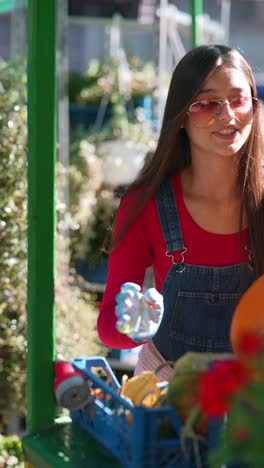 woman selling produce at an outdoor market