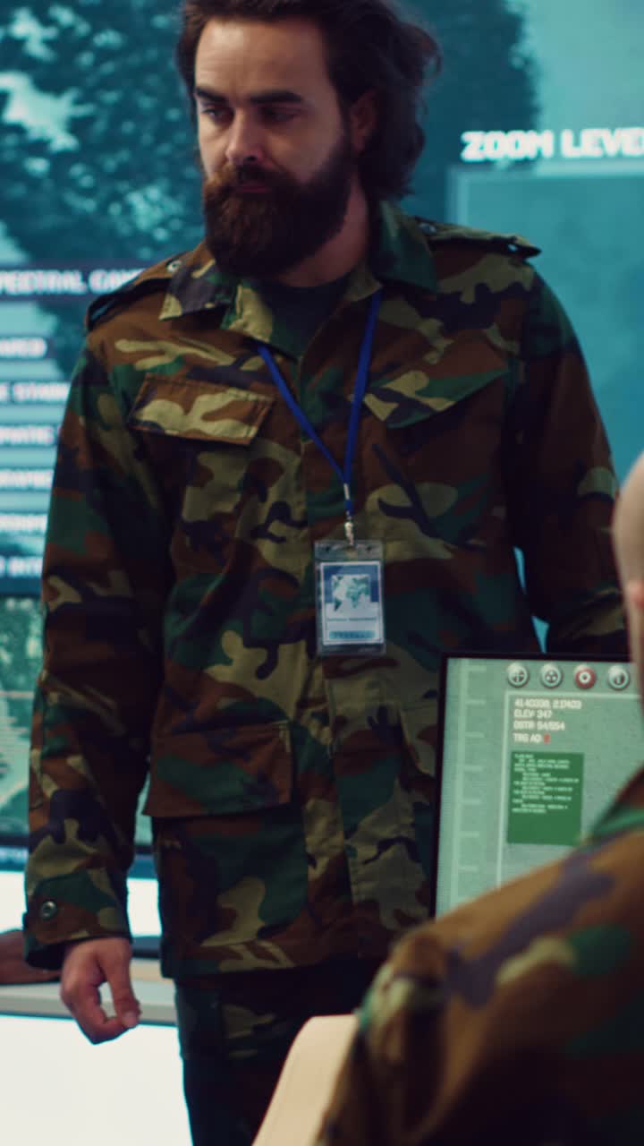 Military Personnel Analyzing Data in High-Tech Command Center